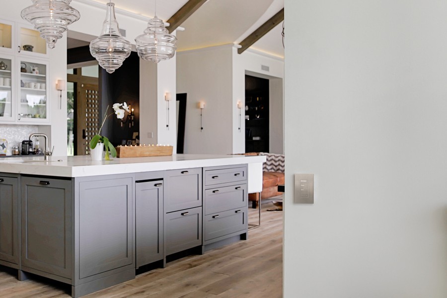 A modern Utah kitchen equipped with Lutron lighting control. 