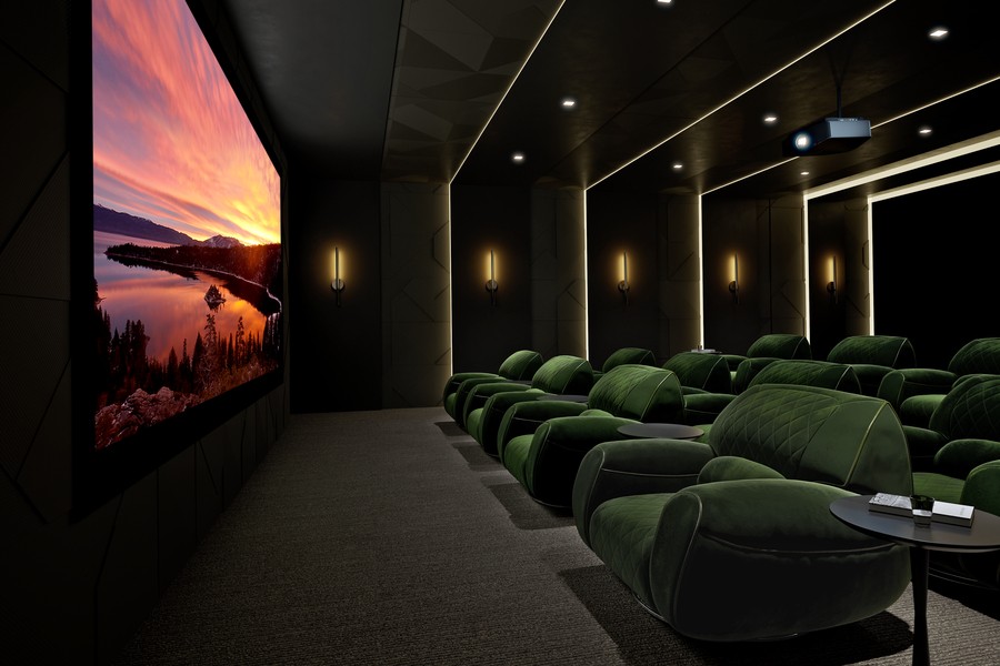 A luxurious home theater in a Bountiful home with plush seating, a large screen, and custom lighting.