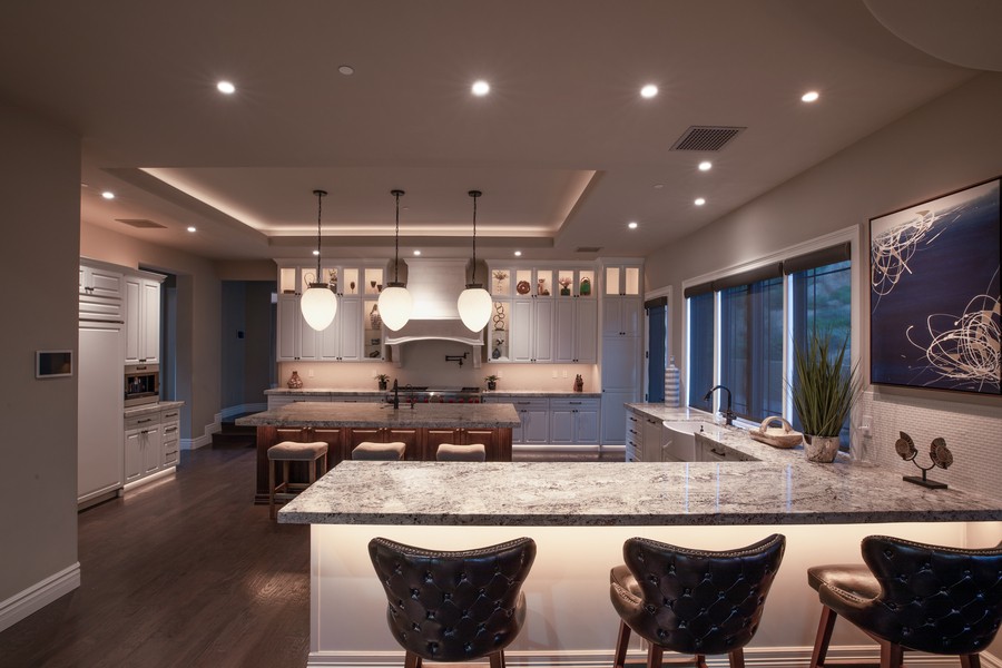  A modern kitchen in Park City employing a layered lighting design. 
